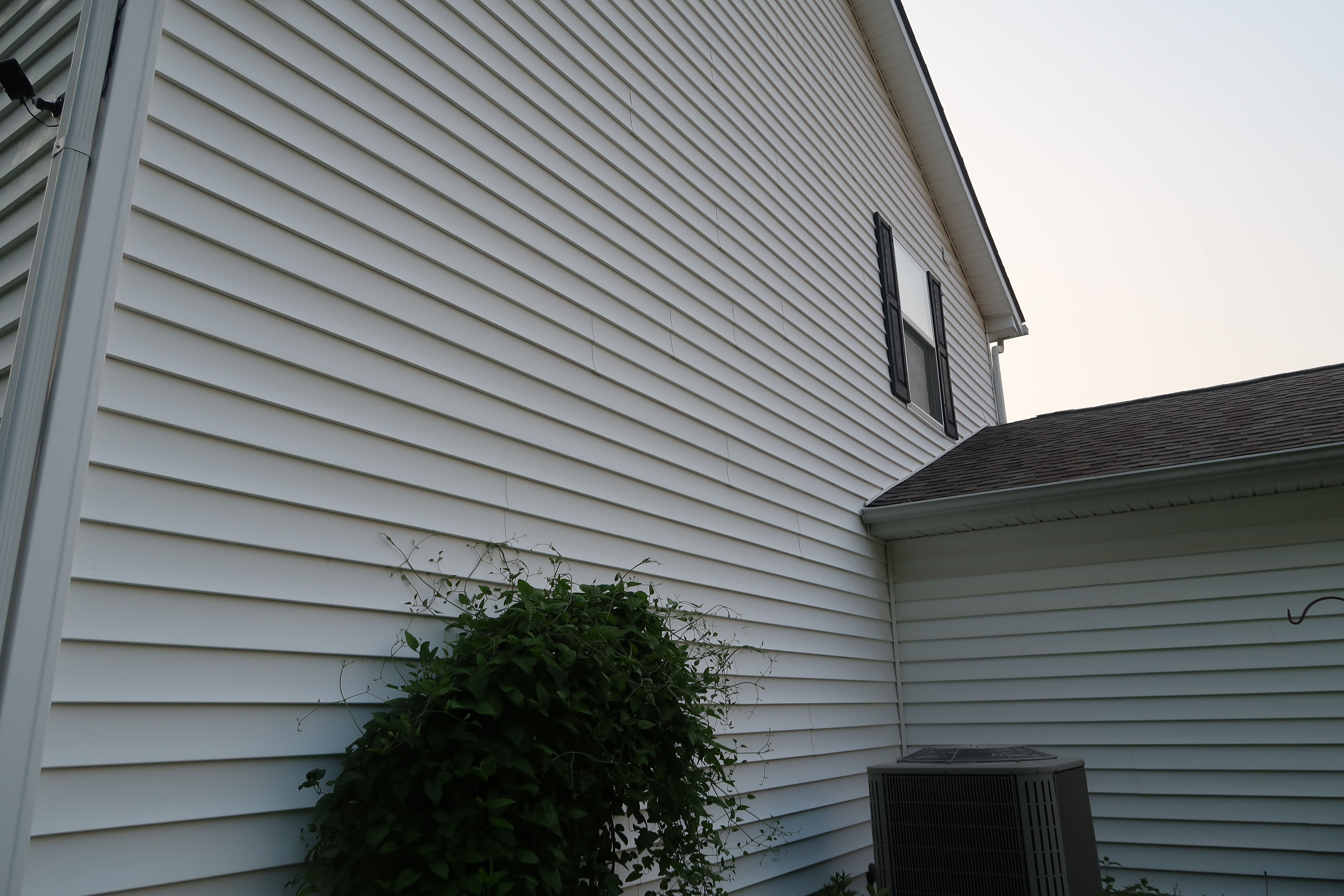 Clean white house siding after washing